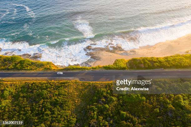 victoria coastal road aerial on sunset - main road stock pictures, royalty-free photos & images