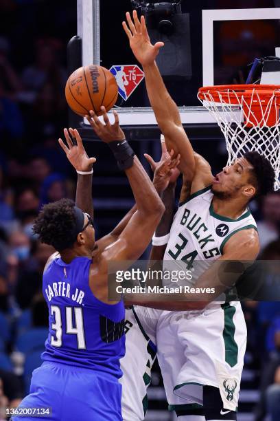 Giannis Antetokounmpo of the Milwaukee Bucks blocks a shot by Wendell Carter Jr. #34 of the Orlando Magic during the second half at Amway Center on...