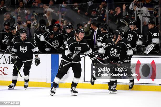 Brendan Lemieux and Blake Lizotte of the Los Angeles Kings react after the final save by teammate Jonathan Quick after a shootout against the...