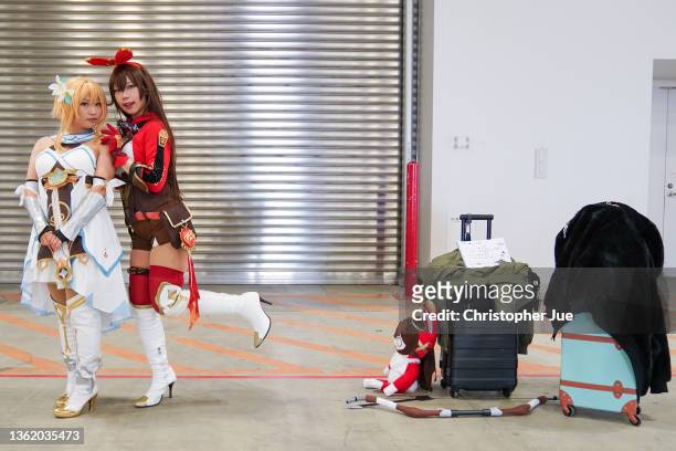Cosplayers pose during the Comiket 99 at Tokyo Big Sight on December 31, 2021 in Tokyo, Japan.