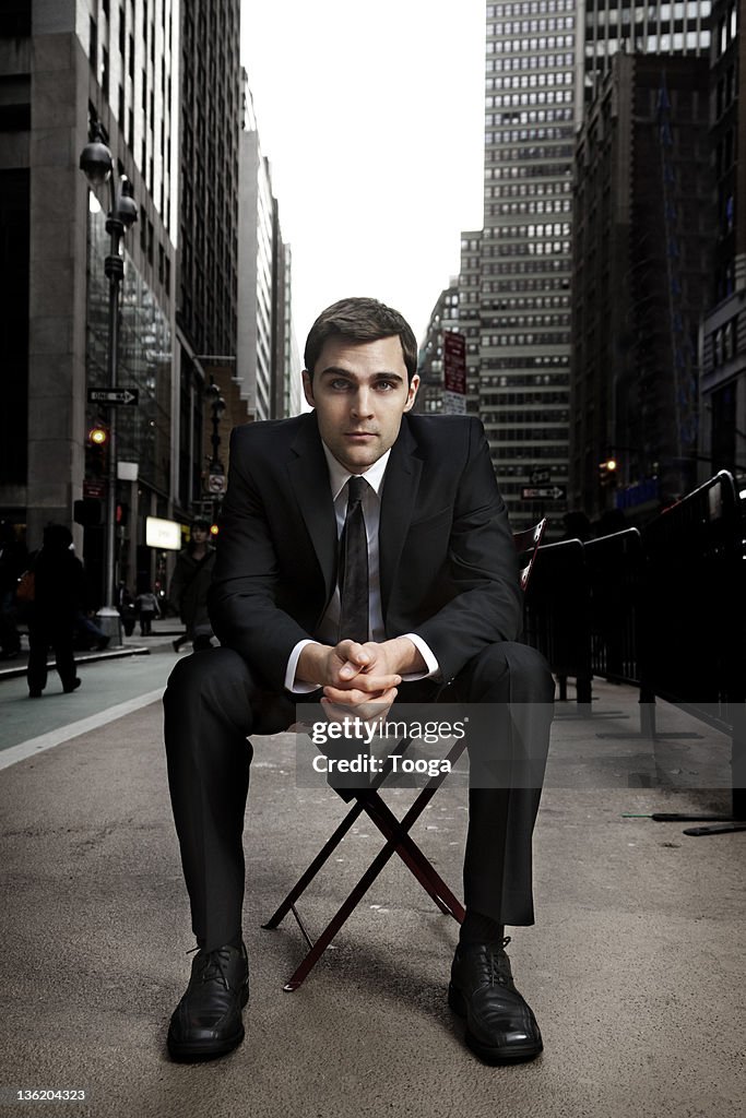 Businessman sitting in Times Square