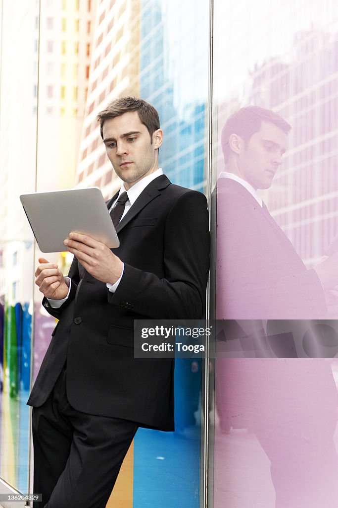 Businessman reading digital tablet
