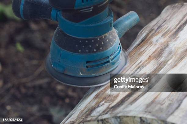 grinding machine on a tree stump. - tree stump grinding stock pictures, royalty-free photos & images
