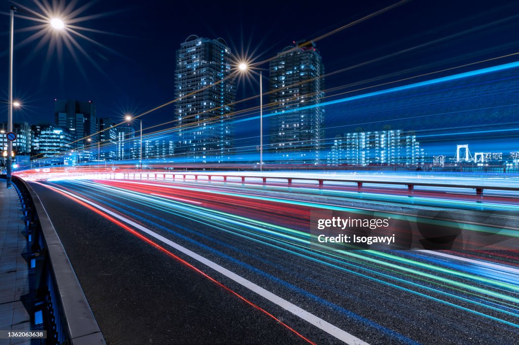 Tokyo Waterfront City Skyline And Light Trails At Night