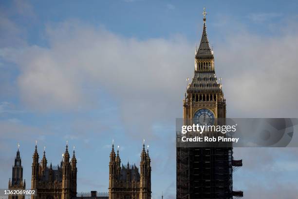 The eastern face of Elizabeth Tower is seen just after midday on December 31, 2021 in London, England. The Elizabeth Tower is part of the Houses of...