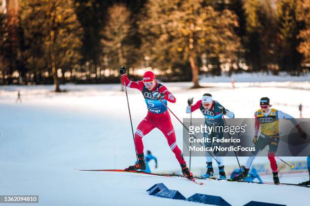 Alexander Bolshunov of Russia, Andrew Musgrave of Great Britain, Johannes Hoesflot Klaebo of Norway compete during the Mass Men at the FIS World Cup...