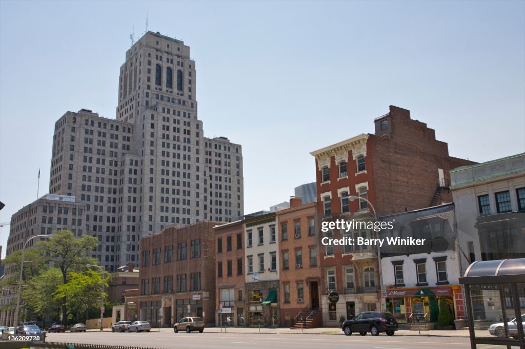 Small buildings and huge office tower.