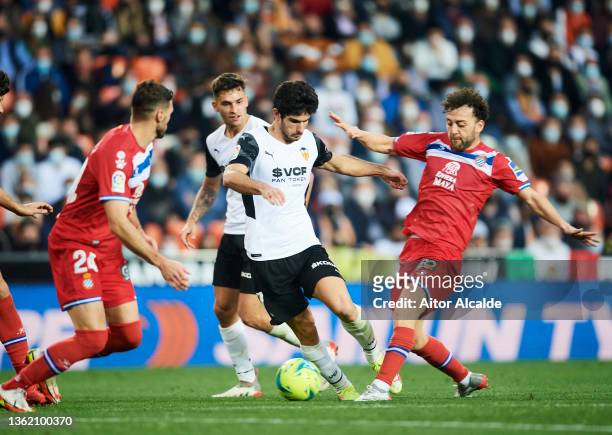 Keidi Bare of RCD Espanyol duels for the ball with Goncalo Guedes of Valencia CF during the LaLiga Santander match between Valencia CF and RCD...
