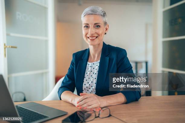 business woman at the office - bank manager stock pictures, royalty-free photos & images
