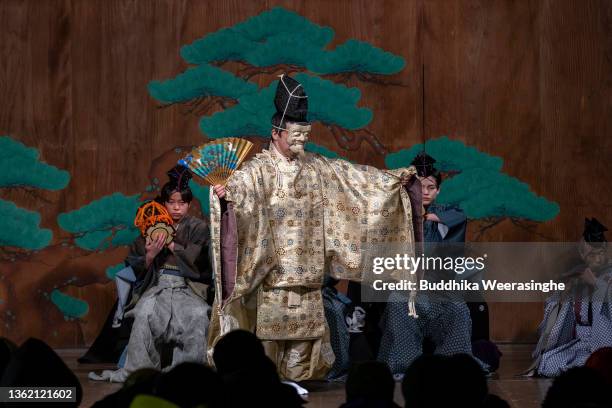 Professional actor dances during a performance of ‘Noh’ to celebrate the New Year on a traditional outdoor stage at the Kasuga Shinto shrine on...