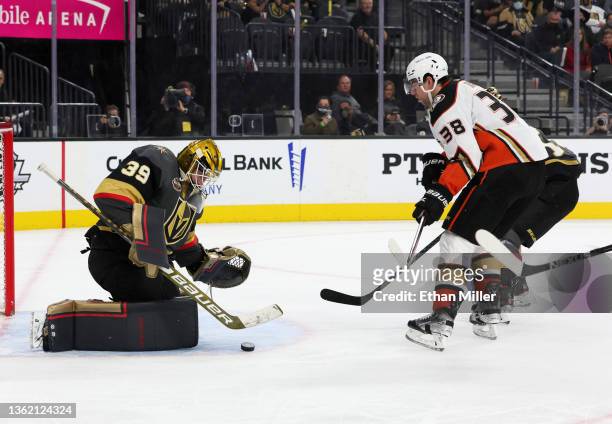 Laurent Brossoit of the Vegas Golden Knights makes a save against Derek Grant of the Anaheim Ducks in the first period of their game at T-Mobile...