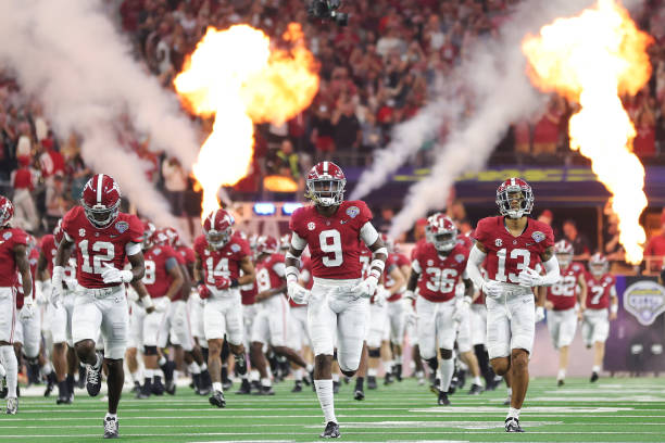 Alabama Crimson Tide players takes the field prior to playing the Cincinnati Bearcats in the Goodyear Cotton Bowl Classic for the College Football...