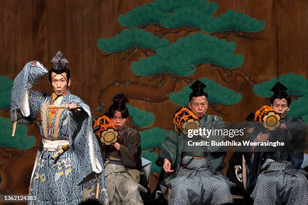 Professional actor dances during a performance of ‘Noh’ to celebrate the New Year on a traditional outdoor stage at the Kasuga Shinto shrine on...