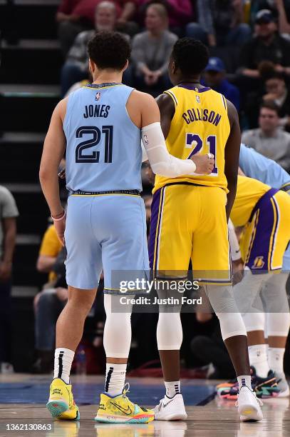 Memphis Grizzlies guard Tyus Jones and Los Angeles Lakers guard Darren Collison during the game at FedExForum on December 29, 2021 in Memphis,...