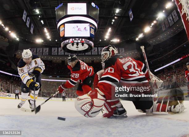 Thomas Vanek of the Buffalo Sabres scores a second period goal against Martin Brodeur of the New Jersey Devils at the Prudential Center on December...