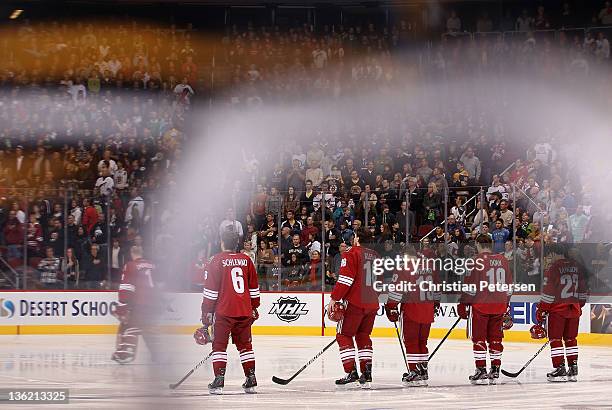 David Schlemko, Rostislav Klesla, Ray Whitney, Shane Doan and Daymond Langkow of the Phoenix Coyotes stand attended for the National Anthem before...