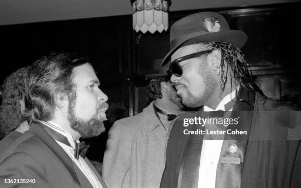 Chairman and CEO of MCA Al Teller and American R&B/pop songwriter Jimmy Jam talk during a 1987 Grammy after party on February 24, 1987 in Los...