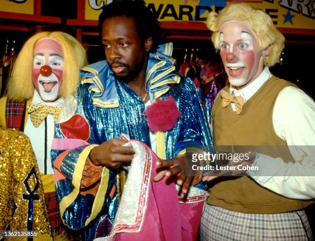 Haitian rapper, singer, songwriter and actor Wyclef Jean, poses for a portrait with clowns before the Ringling Bros. And Barnum & Bailey circus show...