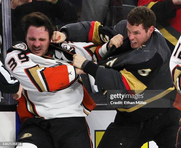 Sam Carrick of the Anaheim Ducks and Brayden McNabb of the Vegas Golden Knights fight in the third period of their game at T-Mobile Arena on December...