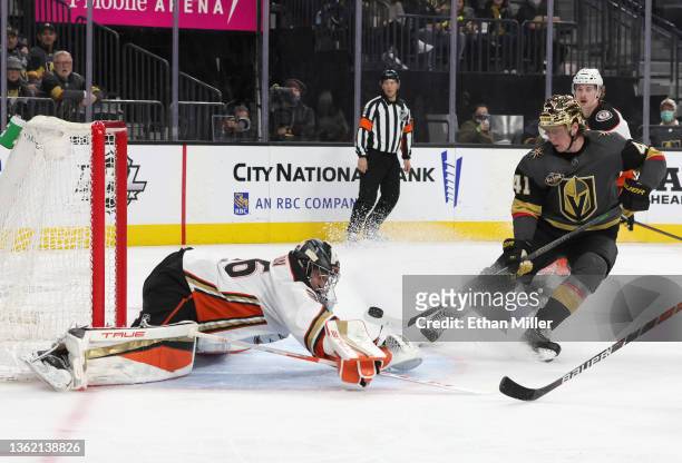 John Gibson of the Anaheim Ducks makes a save as Nolan Patrick of the Vegas Golden Knights looks for a rebound in the second period of their game at...