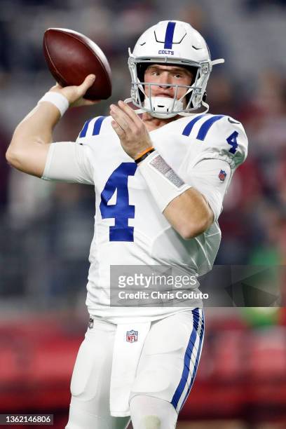 Quarterback Sam Ehlinger of the Indianapolis Colts warms up before the game against the Arizona Cardinals at State Farm Stadium on December 25, 2021...