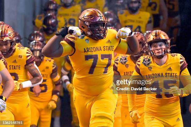 Offensive lineman LaDarius Henderson of the Arizona State Sun Devils reacts as he runs on to the field before the SRS Distribution Las Vegas Bowl...