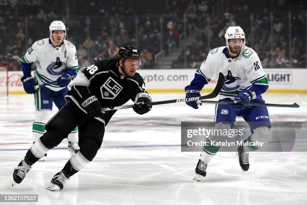 Brendan Lemieux of the Los Angeles Kings skates against Jason Dickinson of the Vancouver Canucks during the second period at Crypto.com Arena on...