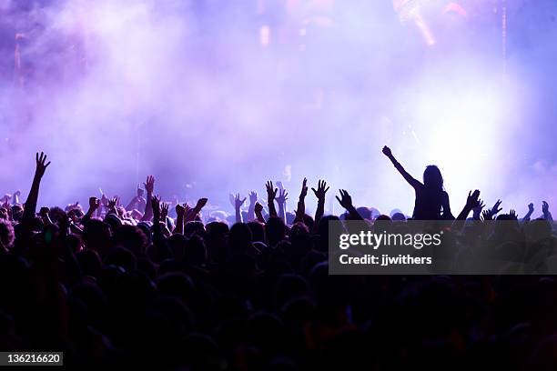 back lit crowd of hands at concert - noise pop stock pictures, royalty-free photos & images