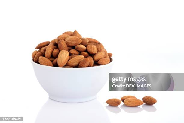 bowl of almonds - almonds foto e immagini stock