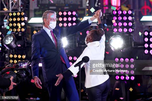 Bill de Blasio and Chirlane McCray dance onstage after the ball drop during the Times Square New Year's Eve 2022 Celebration on January 01, 2022 in...