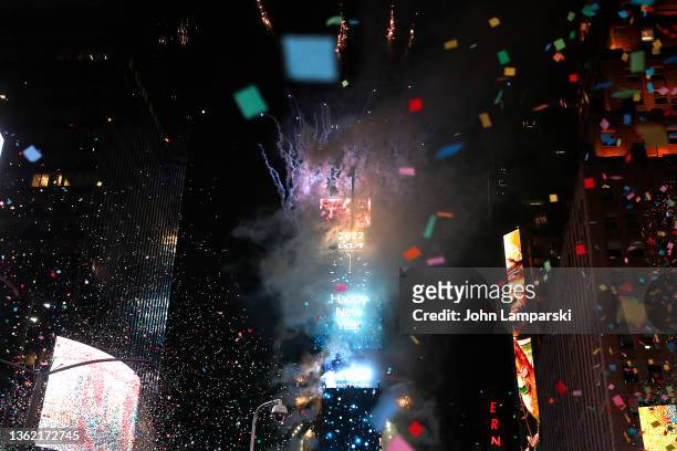 Confetti fall as the ball drops over Times Square during the 2022 New Year’s Eve celebrations on January 01, 2022 in New York City. Despite a major...