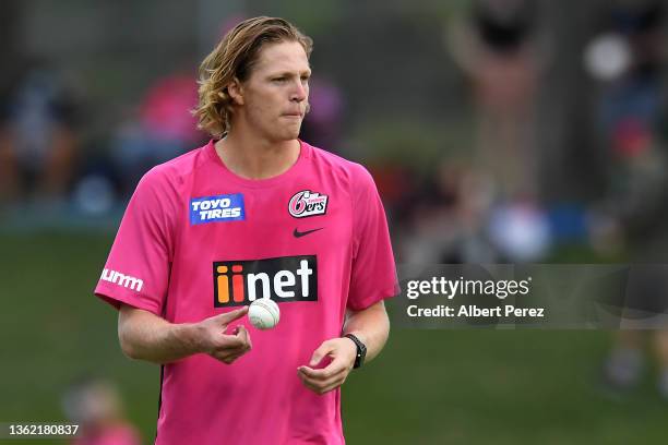 Mickey Edwards of the Sixers warm sup ahead of the Men's Big Bash League match between the Sydney Sixers and the Melbourne Renegades at Coffs Harbour...