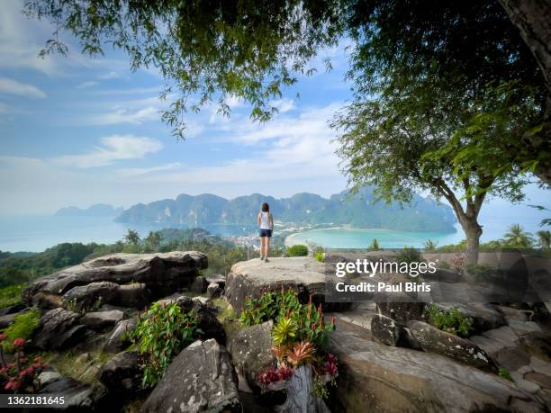 young backpacker woman enjoys the beautiful view over phi phi islands in thailand - phi phi island stock pictures, royalty-free photos & images