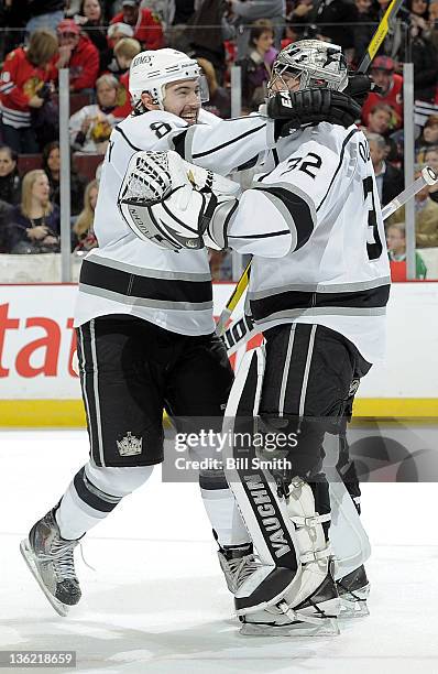 Drew Doughty of the Los Angeles Kings hugs teammate goalie Jonathan Quick after the Kings shut out the Chicago Blackhawks during the NHL game on...