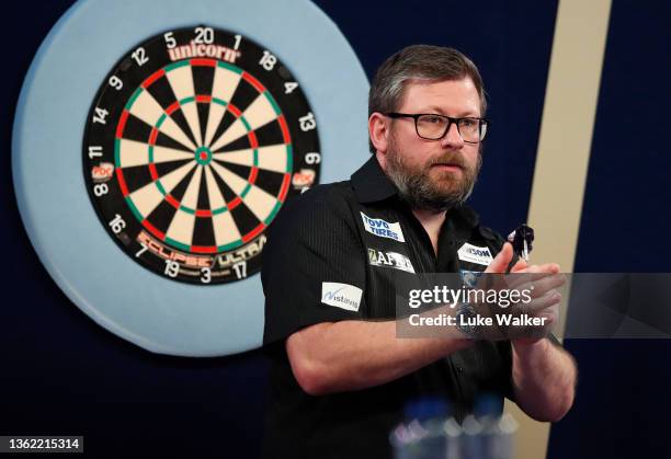 James Wade of England reacts to the wi during his Quarter-Finals Match against Mervyn King of England during Day Fourteen of The William Hill World...