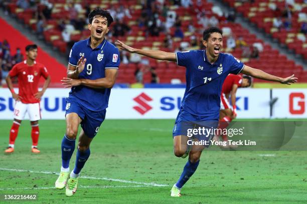 Adisak Kraisorn of Thailand celebrates with Bordin Phala after scoring their first goal against Indonesia in the second half during the second leg of...