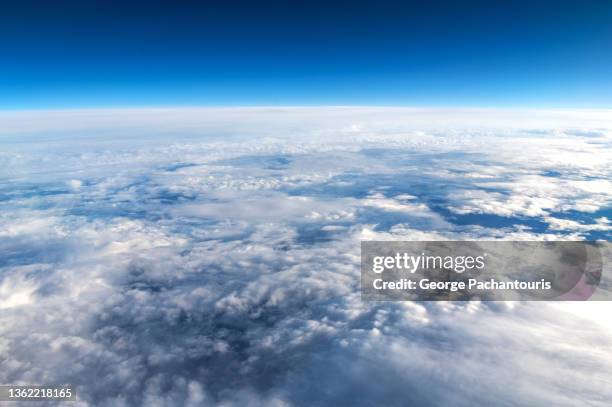 aerial photo of clouds from while in flight - stratosphere stock pictures, royalty-free photos & images
