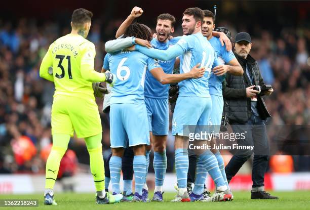 Manchester City players celebrate at full time after the Premier League match between Arsenal and Manchester City at Emirates Stadium on January 01,...
