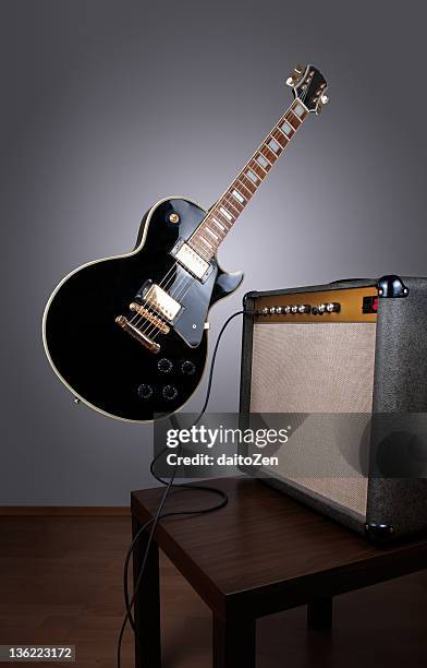 levitating electric guitar - electric guitar stock pictures, royalty-free photos & images