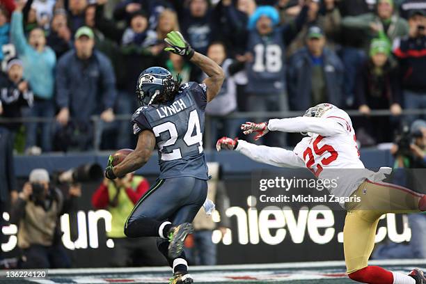 Marshawn Lynch of the Seattle Seahawks rushes for a 4-yard touchdown during the game against the San Francisco 49ers at CenturyLink Field on December...