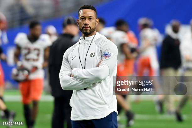 Head coach Marcus Freeman of the Notre Dame Fighting Irish looks on before the PlayStation Fiesta Bowl against the Oklahoma State Cowboys at State...