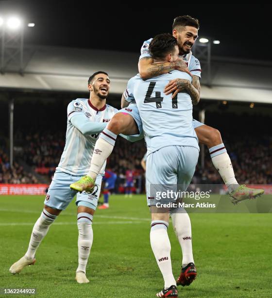 Manuel Lanzini of West Ham United celebrates with teammates Said Benrahma and Declan Rice after scoring their side's second goal during the Premier...