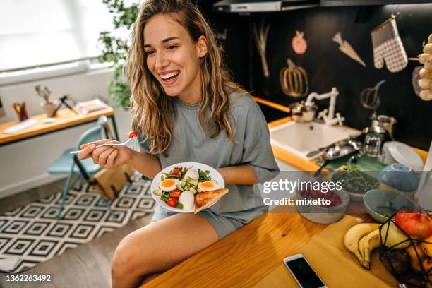 women eating healthy breakfast at home - breakfast plate stock pictures, royalty-free photos & images