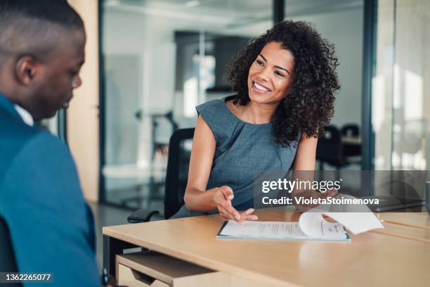 business people signing a contract. - serving stockfoto's en -beelden