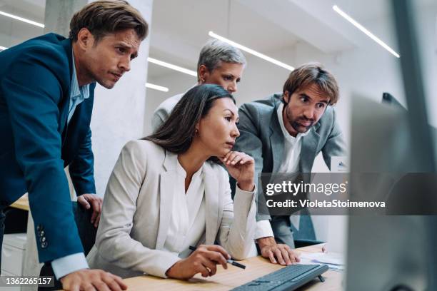 corporate business people working together in office - four bussines man at office imagens e fotografias de stock