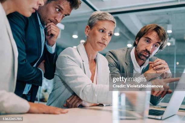 team of professionals during a meeting. - crisis imagens e fotografias de stock