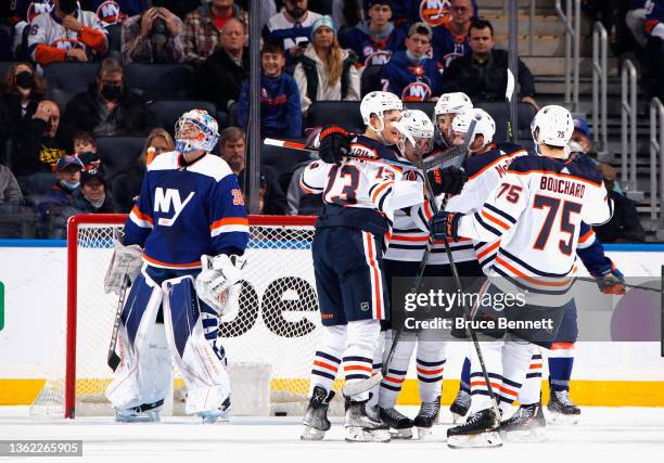 The Edmonton Oilers celebrate a goal by Darnell Nurse against the New York Islanders at 17:13 of the second period at the UBS Arena on January 01,...