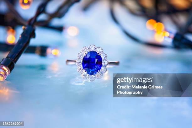 sapphire and diamond ring on frosted ice background - sapphire stock pictures, royalty-free photos & images