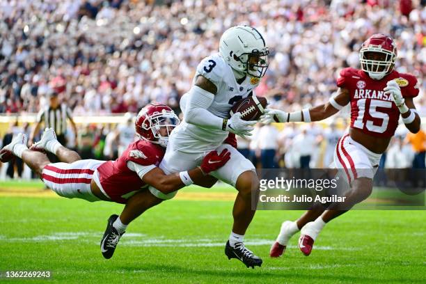 Parker Washington of the Penn State Nittany Lions is tackled by Myles Slusher of the Arkansas Razorbacks after a 42-yard reception in the first...