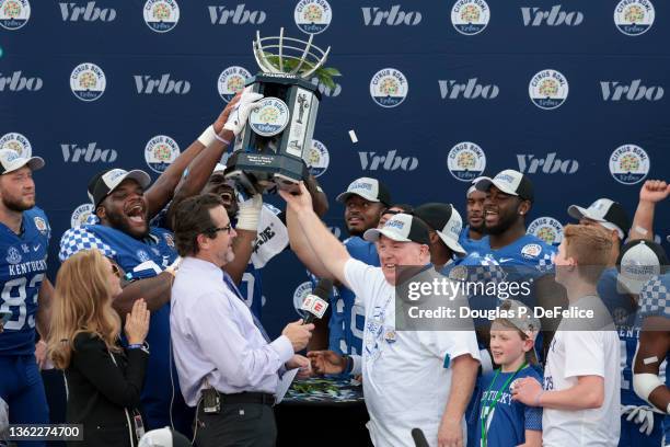 Head coach Mark Stoops of the Kentucky Wildcats reacts after receiving the Citrus Bowl for defeating Iowa Hawkeyes to win the Citrus Bowl at Camping...